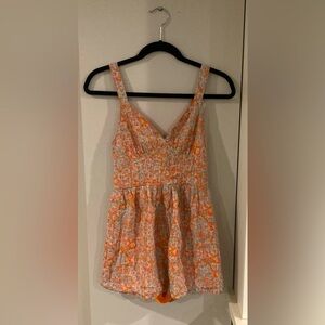 This is a cute romper with shorts and pockets!